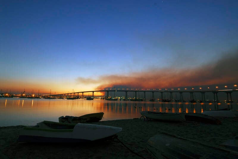 Us Navy N S The Sun Rises Over The Coronado Bay Bridge With Smoke From The Harris Fire Looming Overhead