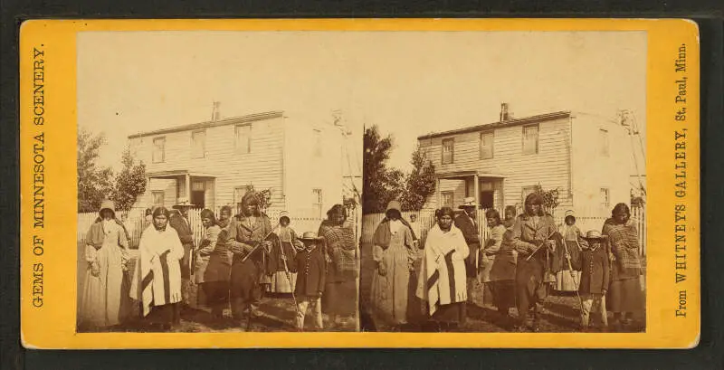 View Of A Group Of Indians With Europeans In The Yard Of Col