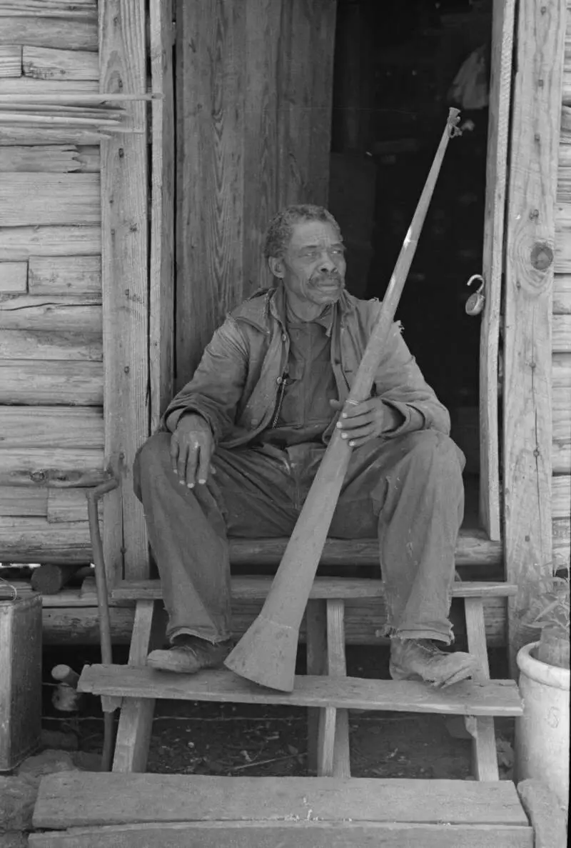 A Former Slave Displaying A Horn Used To Call Slaves